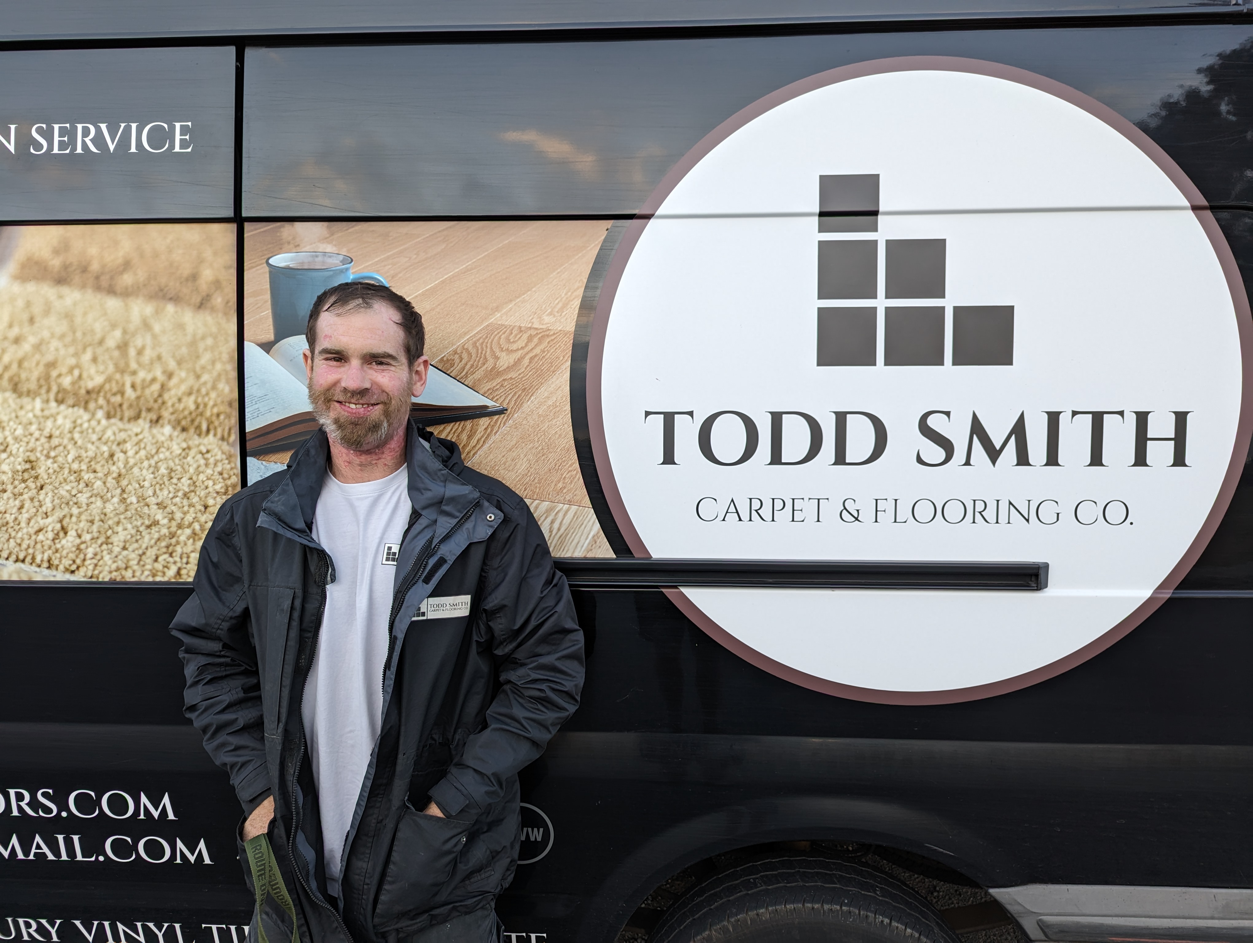 Todd Smith, owner of Todd Smith Carpet & Flooring Co., with his branded van